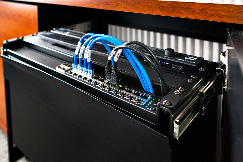 Close view of organized blue cabling and equipment connections in the rack